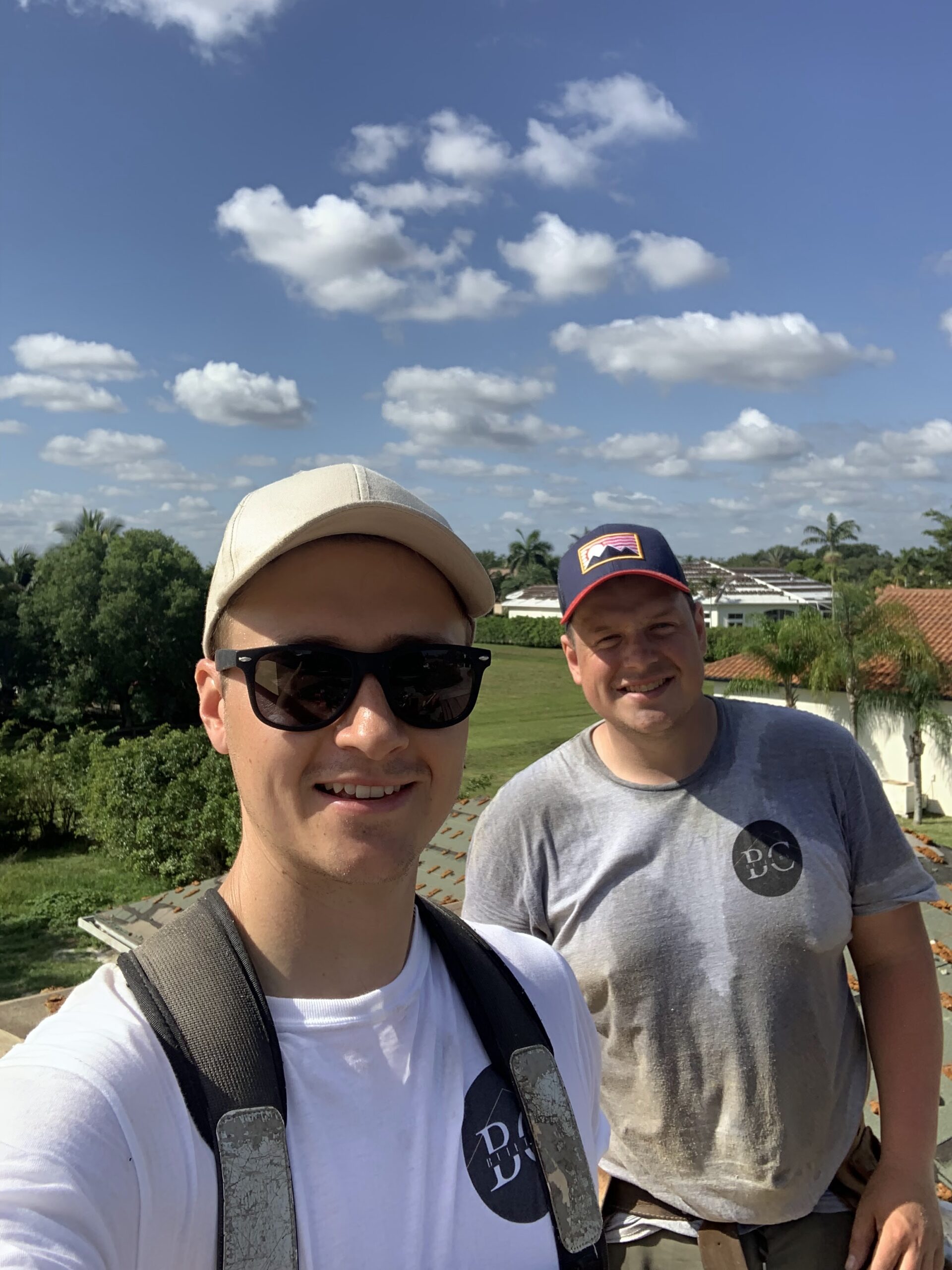 Two men standing side by side.